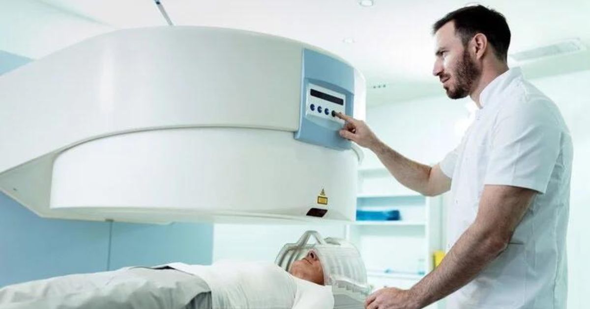 An oncology doctor diagnoses a patient in a cancer clinic through a cancer detection scanning machine